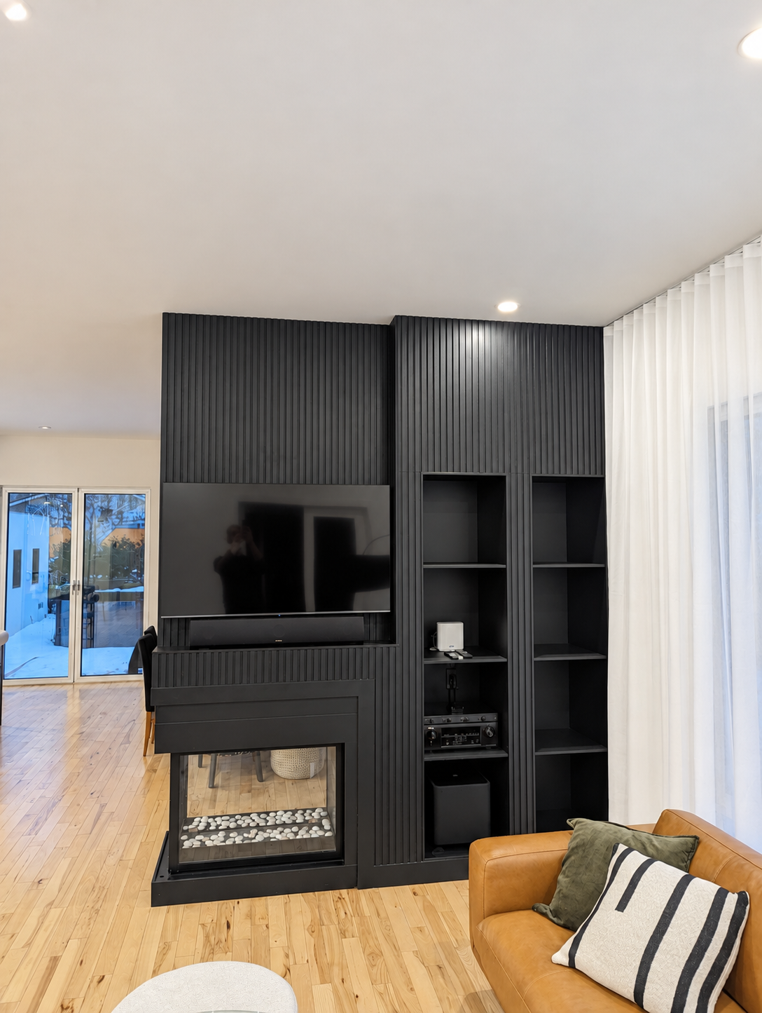 Fireplace front and television after renovation — Sainte-Julie.